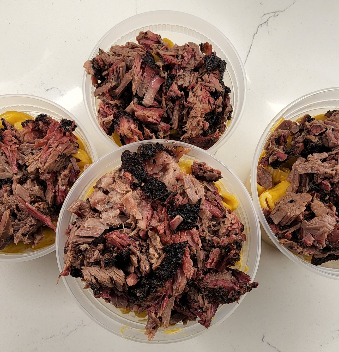 Tubs of pulled pork and chopped brisket